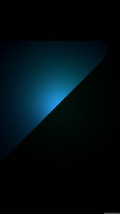 a black and blue background with some light