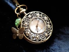 Pendant Watch Necklace Real Flowers Green & Butterfly Art | Etsy Green Vintage Charm Jewelry For Gift, Green Vintage Charm Jewelry Gift, Antique Gold Quartz Pocket Watch As Gift, Antique Gold Timeless Pocket Watch, Antique Gold Timeless Pocket Watch Gift, Antique Gold Timeless Pocket Watch As Gift, Antique Gold Timeless Pocket Watch For Gift, Timeless Antique Gold Pocket Watch As Gift, Vintage Handmade Pocket Watch As Gift