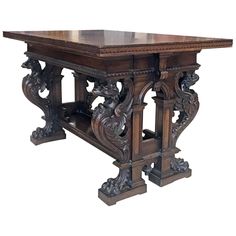 a wooden table with carvings on the top and bottom part, in an ornate manner