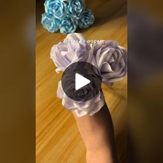 the video shows how to make paper flowers