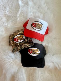 Customizable high crown, foam or structured, adjustable snap back trucker hat detailed with our "Wilder Rodeo'" design on an embroidered patch. One size fits most. Hats shown in listing image: (Top) Red/white hat (Middle) Camo-2 hat (Bottom) Black hat Trucker Hat With Embroidered Patch And Flat Brim, Trucker Snapback Hat With Embroidered Patch, Trucker Hat With Embroidered Patch For Streetwear, Adjustable Trucker Hat With Logo Patch, Trucker Hat With Embroidered Logo And Flat Brim, Trucker Hat With Embroidered Logo And 5-panel Design, Adjustable Trucker Hat With Embroidered Logo, One Size Flat Brim Trucker Hat With Logo Patch, Trucker Snapback Hat For Baseball Season