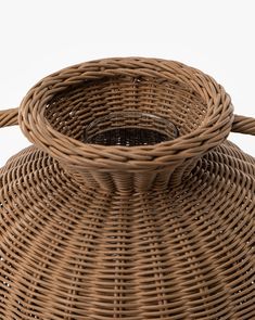 a brown wicker basket sitting on top of a table