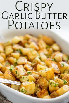 crispy garlic butter potatoes in a white casserole dish