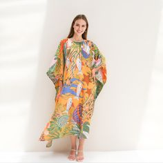 A classic ferns print on twill silk kaftan with one size fit all will be a perfect gift to her and also good for lounging home. It's flowy, soft and elegant touch.  FEATURES - Vintage prints elephants, and safari - Personal Custom Made - Full Length Kaftan Half-Sleeves - Designer Silk Kaftan - Plus Size and Custom Length - Resort Wear, Beach Wear, Lounge Wear, Pool Cover Up Kaftan - crew -------------------------------- DETAIL  * Length : 130 CM & Width 130 CM * Please note, we don't provide exact in dimension but will try best to reach the request, error 1-4 cm may occur due to fabric' nature, manually cutting & sewing, etc. -------------------------------- FREE Customization service - Cut shorter from the 130 CM  -------------------- FABRIC *Silk Twill 90% + 10 % Viscose ( The fabric is Tropical Green Kaftan For Beach Cover-up, Yellow Kaftan For Beach Cover-up, Patterned Kaftan For Summer Beach Cover-up, Patterned Kaftan With Kimono Sleeves For Beach, Oversized Green Maxi Dress For Beach, Beach Season Printed Kaftan With Kimono Sleeves, Summer Kaftan With Kimono Sleeves And Printed Design, Bohemian Leaf Print Dresses For Vacation, Bohemian Leaf Print Vacation Dress