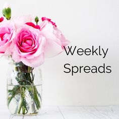 a vase filled with pink flowers sitting on top of a white table next to the words christmas bujo inspiration