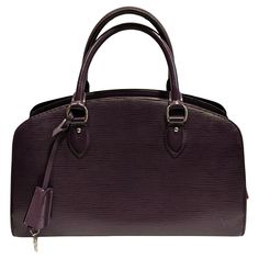 Louis Vuitton Purple Epi Patent Jasmine Bag Louis Vuitton Violet Epi Patent Jasmine Bag. This handbag is made from Louis Vuitton's signature violet textured epi leather. The bag has leather top handles and is decorated with polished silver hardware. Fit: Women Category: Bags Subcategory: Handbags Designer: Louis Vuitton Model: Pont Neuf Vintage Material: Leather Color: Violet Measurement: Width 35 cm 13,77 inches / Height 23 cm 9,05 inches/ Depth 10 cm 3,93 inches Classic Purple Rectangular Bag, Luxury Purple Pouch Bag, Classic Pouch Bag With Handles, Luxury Purple Shoulder Bag For Office, Luxury Purple Bag With Top Carry Handle, Classic Purple Top Handle Bag, Elegant Purple Bag With Top Carry Handle, Purple Top Handle Bag For Office, Purple Shoulder Bag For Office