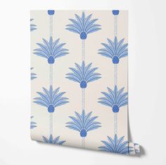 a wallpaper with blue flowers on it and a white background that is in the shape of a flower