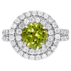 18K white gold ring set with a very desirable 1.41 carat round Peridot, decorated with a total of 0.93 carat round brilliant diamonds. Ring size 5.25. Re-sizing is complementary upon request. Returns are accepted and paid by us within 7 days of delivery. Vintage Cocktail Ring, Peridot Jewelry, Gold Cocktail Ring, Gold Cocktail, Diamonds Ring, Diamond Cocktail Rings, Gold Ring Sets, White Gold Diamond Rings, Peridot Ring