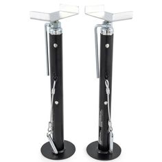 two black and white metal poles with handles