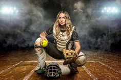 a female baseball player kneeling down with a ball and glove on the ground in front of her