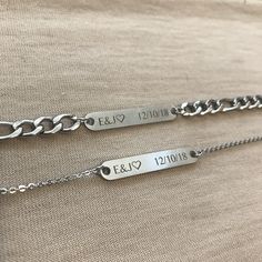 two personalized silver bracelets with names on them