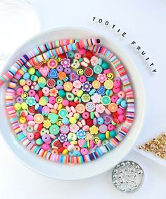 a bowl filled with lots of colorful buttons