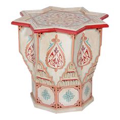 an ornately painted wooden box with red trim