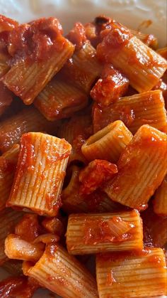 pasta with sauce in a white bowl on a table