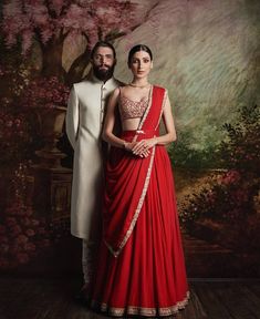 This red color lehenga is in crepe silk embroidered with thread, sequins and zari. Skirt and drape edges are embroidered. Blouse of this draped lehenga is heavily embroidered. Plain Lehenga, Sabyasachi Collection, Sabyasachi Mukherjee, Sabyasachi Lehenga, Lehenga Collection, Indian Bridal Outfits, Indian Couture, Indian Wedding Outfits, Indian Designer Outfits