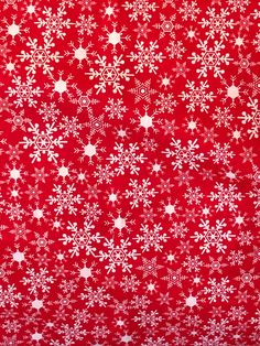 a red background with white snowflakes and stars on the bottom, all over it