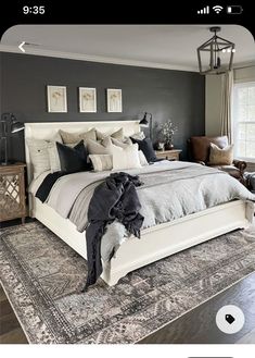 a large bed sitting on top of a wooden floor