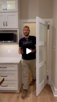 a man standing in front of a kitchen door