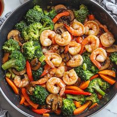 shrimp and broccoli stir fry in a skillet