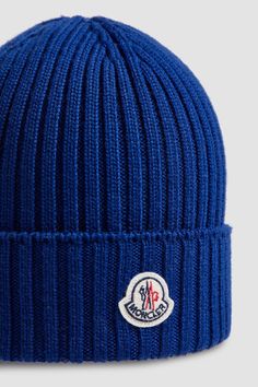 A mid-weight knit, this beanie provides warmth during daily walks and outdoor playtime. The woolen accessory is embellished with a logo patch. Blue Wool Knitted Beanie, Outdoor Blue Knitted Beanie, Blue Wool Beanie, Casual Wool Hat With Embroidered Logo, Moncler Beanie, Shoes For Children, Daily Walks, Blue Beanie, Daily Walk