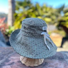 A wide brim sun hat for sunny days and outdoor fun.  This sun hat for women has a nice wide brim to protect your whole face and even your neck and chest. A drawstring around the head keeps the hat fitting snug.  Easy to bring along in your bag, folds up easy.   This hat is made from a medium weight cotton fabric in a sage green floral mosaic pattern.  Inside liner is white cotton.  I used a stiff interfacing for the brim to keep it's shape. Brim measures 4.5" Crown depth is 3.5". Contact me for Custom Fitted Hats, Head Crown, Sage Green Floral, Floral Mosaic, Vacation Accessories, Wide Brim Sun Hat, Mosaic Pattern, Coastal Grandma, Sun Hats For Women