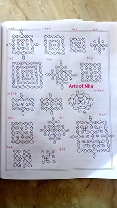 an open book with many different designs on the pages, including numbers and symbols in red ink