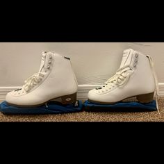 two pairs of ice skates sitting on top of each other