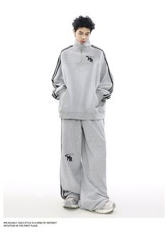 The "Urban Edge Athleisure Set" offers a stylish blend of comfort and street style. Featuring a soft grey zip-up jacket with a subtle chest emblem and matching drawstring pants with sleek side stripes. This tracksuit is perfect for versatile, everyday wear. Gray Athleisure Sweats For Leisure, Gray Athleisure Tracksuit For Leisure, Gray Long Sleeve Tracksuit For Leisure, Sporty Gray Activewear For Leisure, Gray Relaxed Fit Sportswear Tracksuit, Gray Sportswear For Leisure, Sporty Gray Long Sleeve Tracksuit, Gray Sportswear Activewear For Leisure, Gray Long Sleeve Tracksuit With Ribbed Cuffs