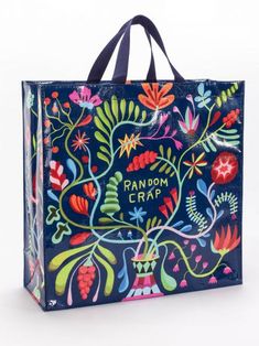 a blue shopping bag with an image of flowers and plants painted on the front in bright colors