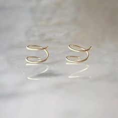 These 14k gold fill spiral earrings are the epitome of simplicity and style, perfect for your everyday look. With their minimalist design, they effortlessly enhance your style, allowing you to make a statement that reflects your unique personality. Embrace the trendy and fun vibes with these captivating spiral earrings, as they effortlessly add a touch of confidence and flair to your daily adventures. ● 14k gold filled ● 8mm diameter Fun Vibes, Double Twist, Spiral Earrings, Sales Gifts, Everyday Look, Minimalist Design, Gold Filled, Twist, Confidence