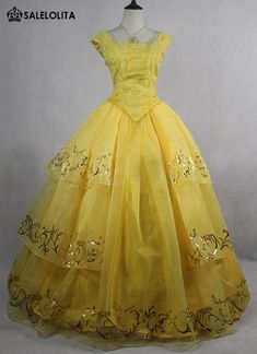 a yellow dress is shown on a mannequin headdress with lace detailing