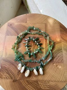 A combination of green aventurine and cowrie shells, the Terra waistbeads are perfect for grounding and promoting a sense of serenity. (Bracelet not included) Can also be purchased as part of the Terra Collection. Bohemian Aventurine Beaded Bracelets, Handmade Green Beaded Strand Bracelets, Green Gemstone Beads Bracelets For Beach, Bohemian Green Shell Jewelry, Green Handmade Bohemian Shell Necklace, Green Beaded Bracelets With Gemstone For Beach, Green Bohemian Shell Necklace With Round Beads, Green Gemstone Beaded Bracelets For Beach, Handmade Green Strand Jewelry