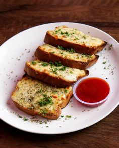 four slices of bread on a plate with ketchup