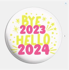 a white button with the words bye 2013 hello 2024 on it and fireworks around it