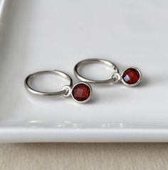 Garnet hoop earrings - sterling silver endless hoops - faceted tiny gemstone charm - convertible earring - simple dainty hoop earrings Simple sterling silver hoops with a removable gemstone charm. 2 styles for the price of one.  More gemstones available here: https://www.etsy.com/ca/listing/970326370/gemstone-hoop-earrings-sterling-silver If you want to purchase an extra pair of gemstones, please contact me. * SIZE: 15mm hoops with a 6mm stone  * MATERIAL: Sterling silver, faceted gemstone, also Stackable Sterling Silver Huggie Earrings As Gift, Sterling Silver Stackable Huggie Earrings As Gift, Sterling Silver Huggie Earrings With Birthstone, Sterling Silver Huggie Stackable Earrings, Dainty Sterling Silver Huggie Earrings With Birthstone, Dainty Sterling Silver Birthstone Huggie Earrings, Gift Sterling Silver Stackable Hoop Earrings, Dainty Sterling Silver Huggie Earrings With Lever Back, Everyday Sterling Silver Hoop Earrings With Birthstone