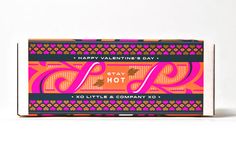 the happy valentine's day soap bar is pink and orange, with an ornate design