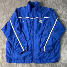 Vintage 2000s Nike Swoosh Check Two Pocket Sportswear Athletic Y2K Aesthetic Blue Zip Up Track Jacket Double Extra Large Mens Condition:  Excellent Used Condition  = No Flaws Measurements: Please see photos above for all measurements IF YOU BUY TWO OR MORE ITEMS USE THE CODE BUNDLE @ CHECK TO SAVE 20% WE SHIP WITHIN 24 HOURS AFTER PURCHASE! Please be aware that we do not offer free returns!! The Buyer is responsible for the cost of the return label.  Follow us on TikTok & Instagram @findsnostalg Cheap Men's Blue Track Jacket, Blue Collegiate Track Jacket For Sports Events, Blue Sportswear Outerwear For College, Blue Sportswear Outerwear, Blue Nylon Track Jacket For Sports, Blue Collegiate Track Jacket For Sports, Collegiate Blue Sports Outerwear, Collegiate Blue Outerwear For Sports, Blue Moisture-wicking Outerwear For Streetwear