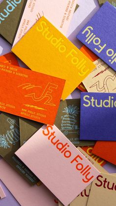 many different colored business cards stacked on top of each other with the words studio foily