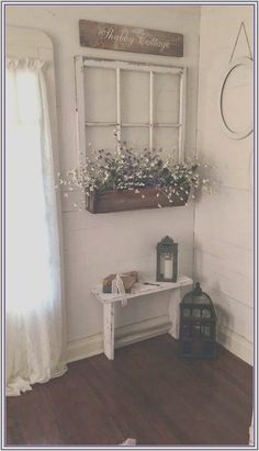 an old window is decorated with flowers and a sign that says welcome to the home