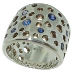 Beautiful Dome Ring features bezel set Blue Sapphires; weighing approx. 0.60tctw; Hand crafted in Rhodium Sterling Silver; the top dome of ring measures approx. 1 inch in length x 0.75 inches wide. Ring size 8. Bold yet unmistakably Feminine! Outstanding in every way...A must have you’ll enjoy for many years to come! Sapphire Gem, Blue Sapphire Gemstone, Wide Ring, Dome Ring, Domed Ring, Sapphire Gemstone, Nespresso Cups, Bezel Setting, Blue Sapphire