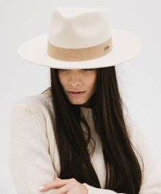 Holly blends two of our most beloved hats into one special silhouette. Miller’s semi-tall fedora crown paired with Monroe’s mid-length upturned brim makes this hat both bold + approachable. Featuring a hand-sewn suede band that’s easy to layer with other accessories. This is a style meant for all hat wearers from novices to pros. Named after our friend Holly, founder of Our Faux Farmhouse, who teamed up with us for this design. Classic Spring Fur Felt Fedora, Elegant Fur Felt Panama Hat For Fall, Fall Panama Hat With Curved Brim In Fur Felt, Elegant Beige Fedora With Flat Crown, Beige Fur Felt Fedora With Short Brim, Elegant Beige Fur Felt Fedora, Elegant Felt Hat With Flat Crown For Spring, Elegant Spring Felt Hat With Flat Crown, Elegant Beige Hat With Flat Crown