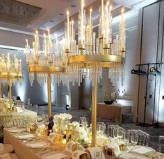 a long table is set with champagne glasses and plates