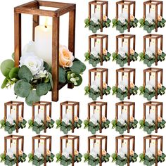 a bunch of white flowers sitting inside of a wooden lantern