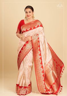 Exclusive Vidya Balan Special! The sight of this stunning Laal Paar Saree make us go, Jiya Dole Haule Haule! The fiery red seamlessly blends with a serene white in this luxurious drape. The decadent borders with charming dome-like motifs in Kadhiyal weaves heighten the elegance of the drape. The luxurious zari work that envelopes the body of the saree celebrates the inimitable craftsmanship of the Banarasi weavers. The  katan silk fabric promises  a lustrous texture and the zari in lays add a di Luxury Banarasi Silk Pre-draped Saree With Zari Work, Luxury Banarasi Silk Saree For Navratri, Luxury Banarasi Silk Pre-draped Saree With Meenakari, Luxury Bollywood Banarasi Silk Pre-draped Saree, Luxury Banarasi Silk Pre-draped Saree For Diwali, Luxury Katan Silk Pre-draped Festive Saree, Luxury Katan Silk Pre-draped Saree For Festive Occasions, Luxury Dola Silk Saree For Celebration, Luxury Red Saree For Diwali