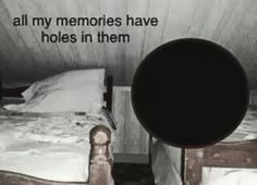 two beds in a small room with a quote on the wall above them that reads, all my memories have holes in them