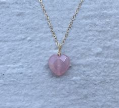 This necklace is handcrafted using a 12mm faceted rose quartz heart pendant and a 14 gold-filled chain. The rose quartz is authentic and AAA quality.  This necklace is hypoallergenic. (Cadium free, lead free, and nickel safe) Rose quartz is a gemstone that promotes love and emotional healing. The necklace comes in a ribbon-wrapped box and is ready to be gifted. If you would like to leave a note for the recipient, you can do so during checkout. Dainty Rose, Rose Quartz Heart, Bottle Necklace, Emotional Healing, Gold Filled Chain, The Rose, Heart Necklace, Crystal Necklace, Heart Pendant