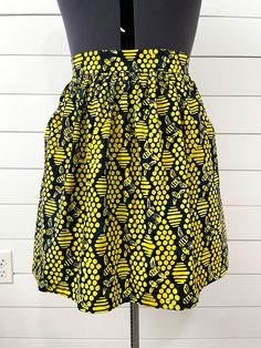 This item is MADE TO ORDER. This handmade black and yellow skirt features bright honey bees, beehives, and honeycombs. It is made out of cotton fabric. It has a flattering flat-front waistband with elastic in the back and cutout pockets. Since the waistband stretches it fits a variety of sizes, but please double check the measurement chart to ensure proper fitting. Great back to school skirt for a cute and fun outfit for teachers, librarians, and educators! Constructed using the Cleo Pattern des Outfit For Teachers, Back To School Skirt, Fair Festival, School Skirt, Yellow Bee, Cottagecore Fairy, Yellow Skirt, Handmade Clothing, Honey Bees