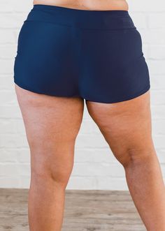 Swim ShortsFit & Sizing High waisted Wide waistband sits just below your natural waist Inseam length 2.7” (Size S) For more fit and sizing info, check out our size chart Features Quick dry Designed to be worn over our favorite bikini bottom Care Rinse in cold water to wash off any chemicals, chlorinated water or saltwater Machine wash in cold water on gentle cycle Lay flat to dry in the shade Material 82% nylon 18% spandex Gusset-100% polyester UPF 50+ Sun prot Sporty Navy Swimwear With Built-in Shorts, Navy Swimwear With Built-in Shorts, Sports Tankini With Built-in Shorts, Navy Bottoms With Built-in Shorts For Beach, Beachwear Brief Swimming Shorts, Beachwear Brief Shorts For Swimming, Beachwear Swimming Shorts, Swimwear With Built-in Shorts For Swimming, Navy Short Length Swim Trunks