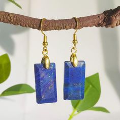 Welcome to a piece of timeless beauty that transcends the ordinary. Introducing our Rectangular Lapis Lazuli Earrings, a perfect blend of elegance and mystique. These earrings are more than just an accessory; they are a statement of your unique style and a tribute to the ancient allure of Lapis Lazuli. Material: Genuine Lapis Lazuli, Real gold plated metal Weight: 1 piece about 3.5g The length of the stone is about 3.5cm/1.37in and the width is about 2.5cm/0.98in. The earhook is of moderate length to ensure that it is stable and comfortable to wear. Design: Each Lapis Lazuli stone is uniquely cut and polished to showcase its inherent clarity and brilliance.  Stone Details: Each earring is a showcase of the natural beauty of Lapis Lazuli, known for its deep blue color with golden flecks of Oblong Jewelry With Matching Earrings For Gifts, Oblong Jewelry Set With Matching Earrings As Gift, Jewelry Set With Matching Earrings As A Gift, Rectangular Single Earring For Gift, Gemstone Drop Earrings, Lapis Lazuli Earrings, Natural Stone Earrings, Lapis Lazuli Stone, Earrings Minimalist