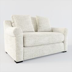 a white couch with two pillows on it